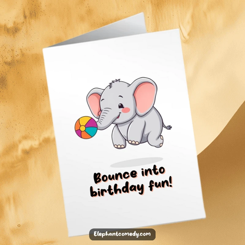 Funny Free Printable Birthday Card: Chubby elephant gleefully bouncing a colorful ball with its trunk, full of celebratory energy.